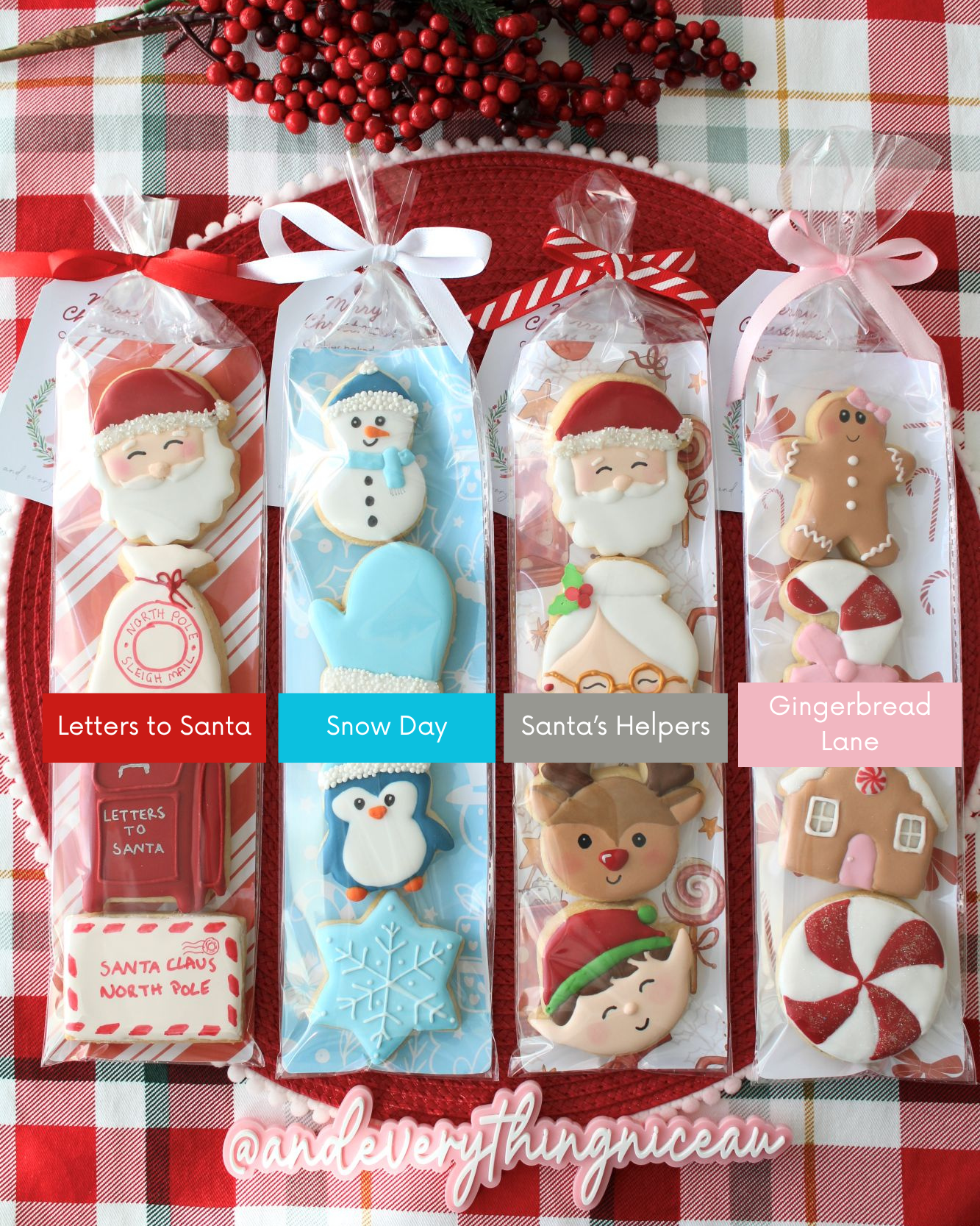 Four Christmas cookie packs, each in a different holiday-themed sleeve with their pack names listed, tied with ribbons and styled on red and green tartan fabric